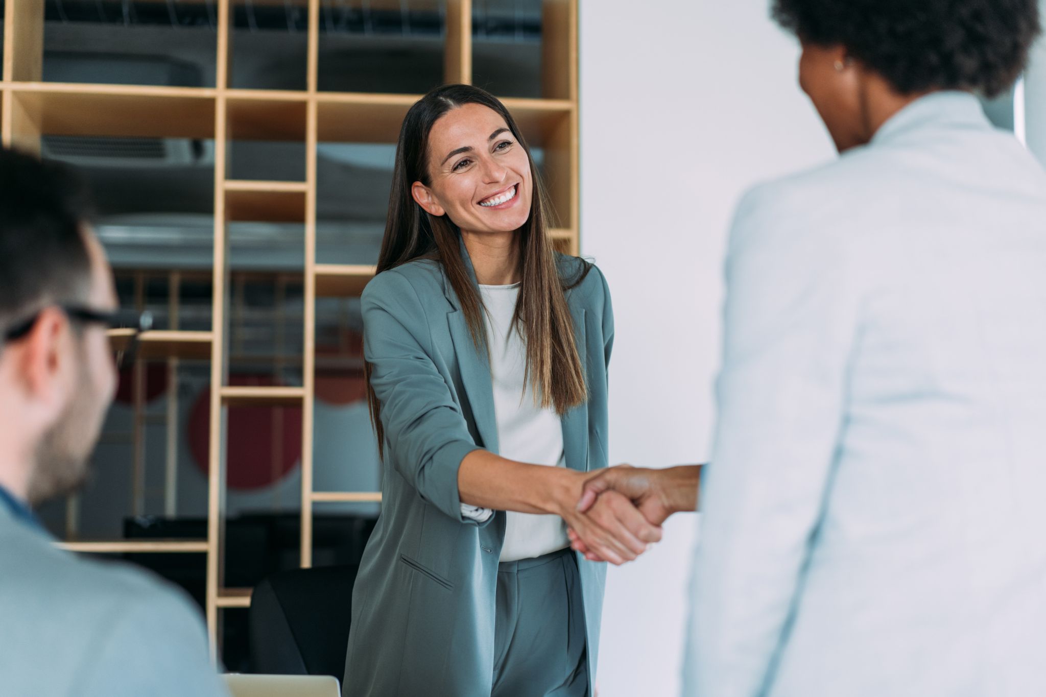 Image depicting two people shaking hands; this represents a GLPI partnership