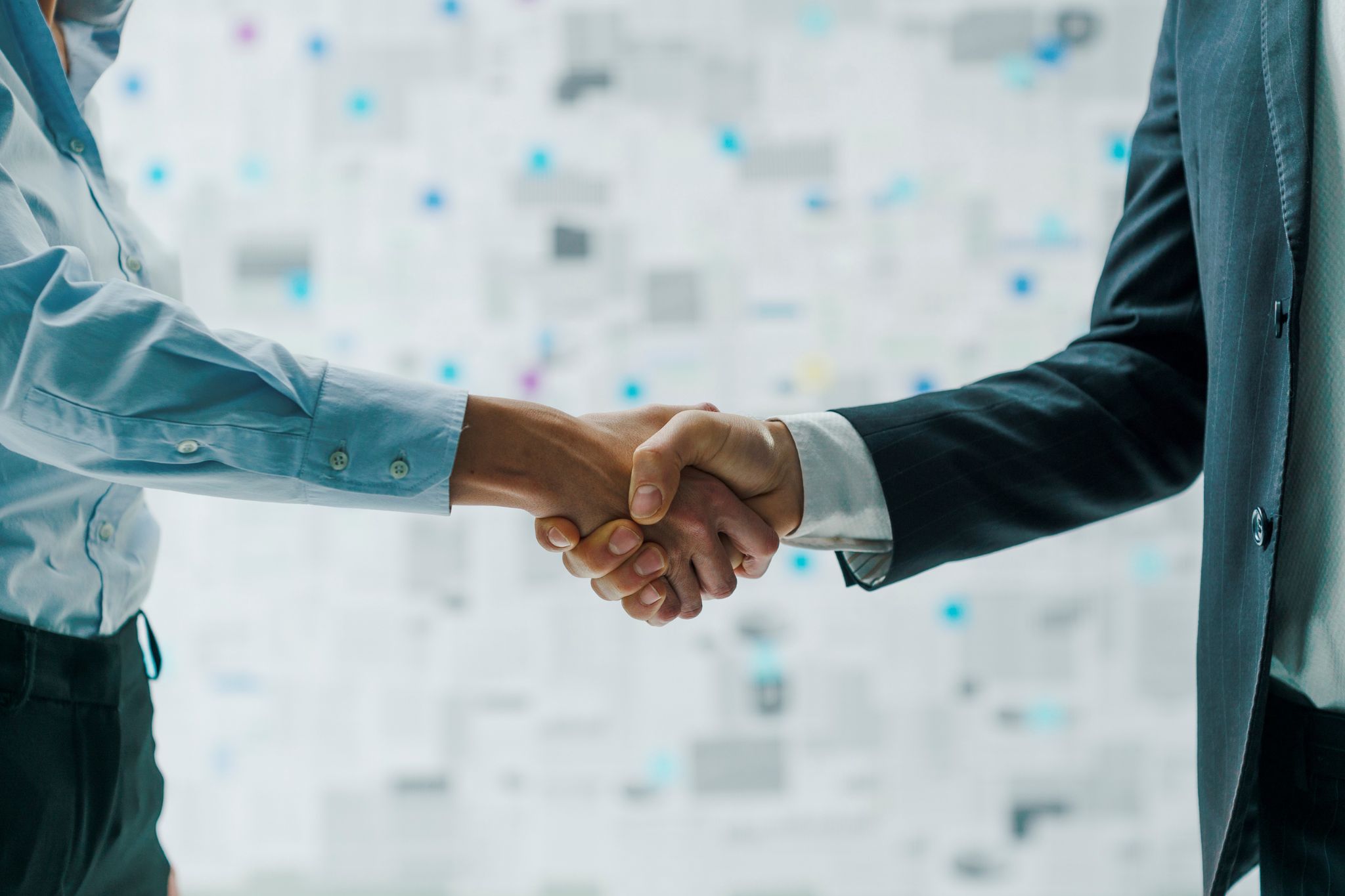 Image depicting two people shaking hands